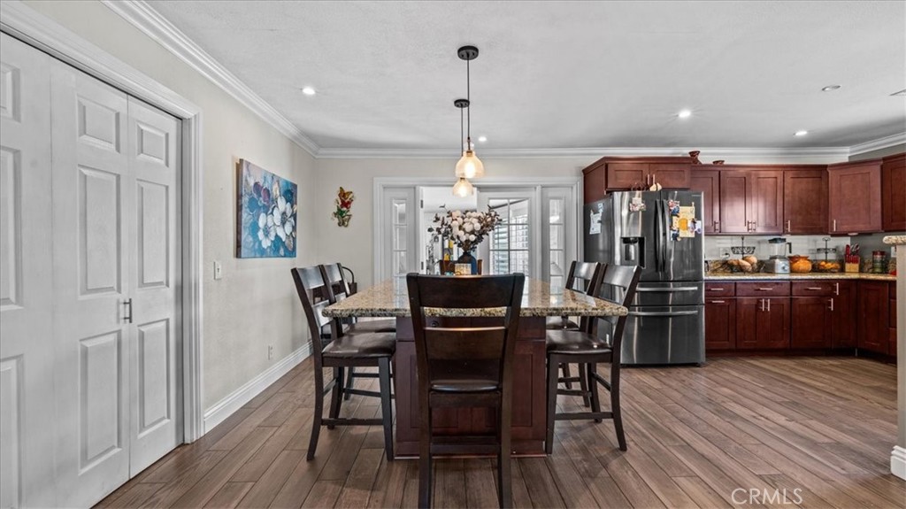 8715 Lurline Street Rancho Cucamonga, CA 91701 - Photo 9 of 41 a view of a dining room with furniture window and wooden floor
