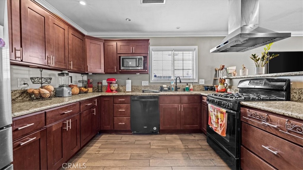 8715 Lurline Street Rancho Cucamonga, CA 91701 - Photo 10 of 41 a kitchen with stainless steel appliances granite countertop a stove a sink dishwasher and a refrigerator