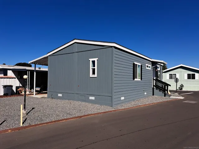 a front view of a house with parking area