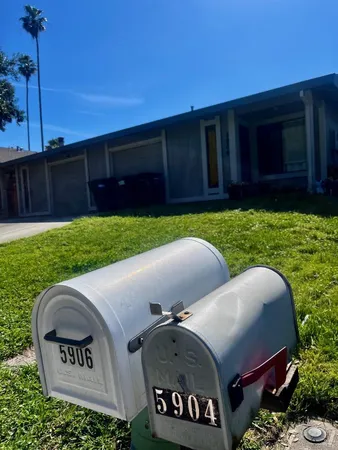a view of backyard with outdoor seating and green space