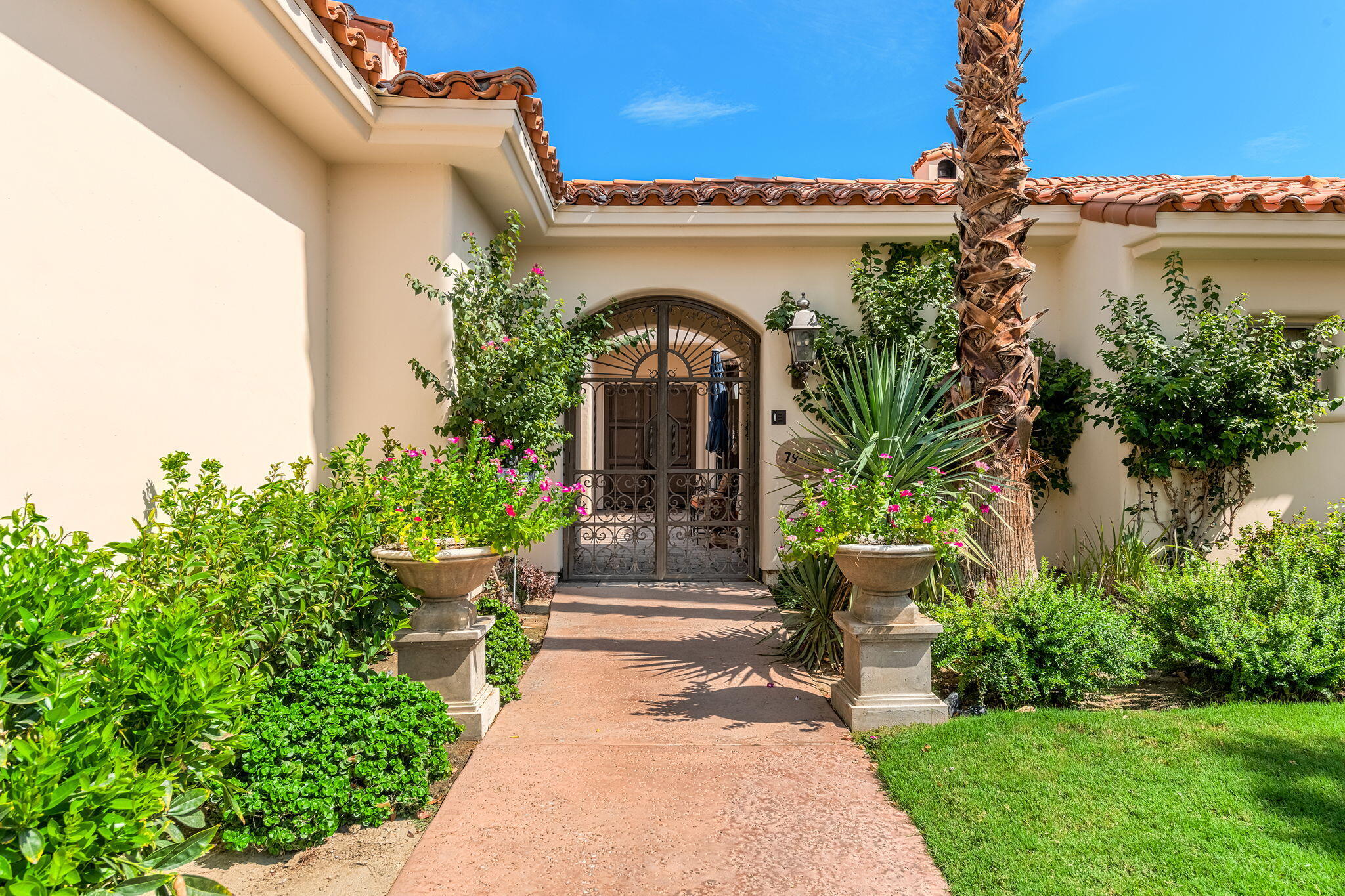 79434 Cetrino La Quinta, CA 92253 - Photo 3 of 35 a front view of a house with a garden