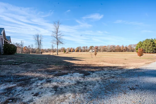 a view of swimming pool with a yard and sitting area