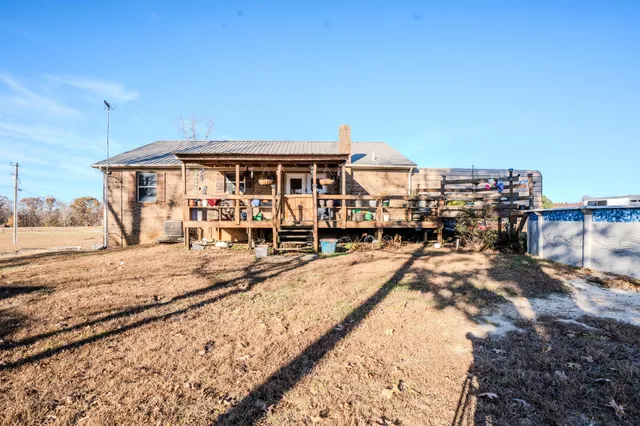 a view of a big house with a big yard