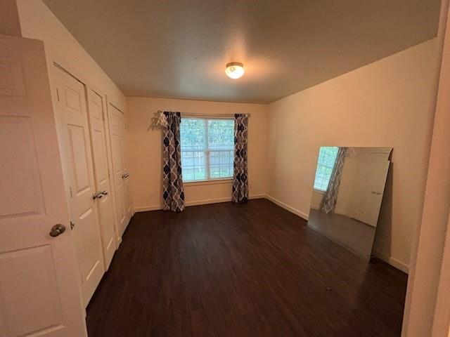 4744 Stokes Street Dallas, TX 75216 - Photo 12 of 20 wooden floor in an empty room with a window