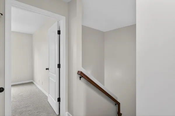 a view of a hallway with stairs