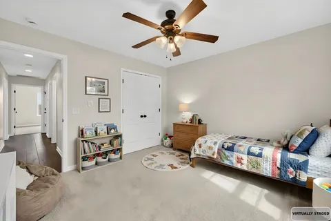 a bedroom with furniture and a chandelier