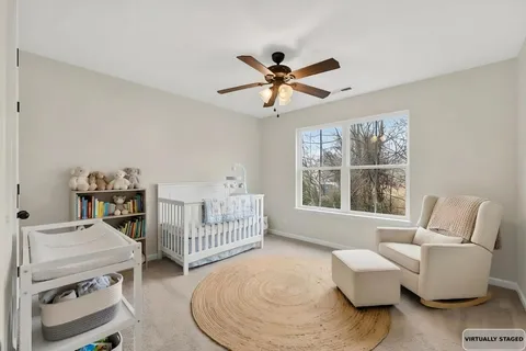 a bedroom with furniture and a window