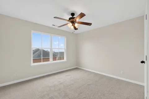 a view of empty room with windows