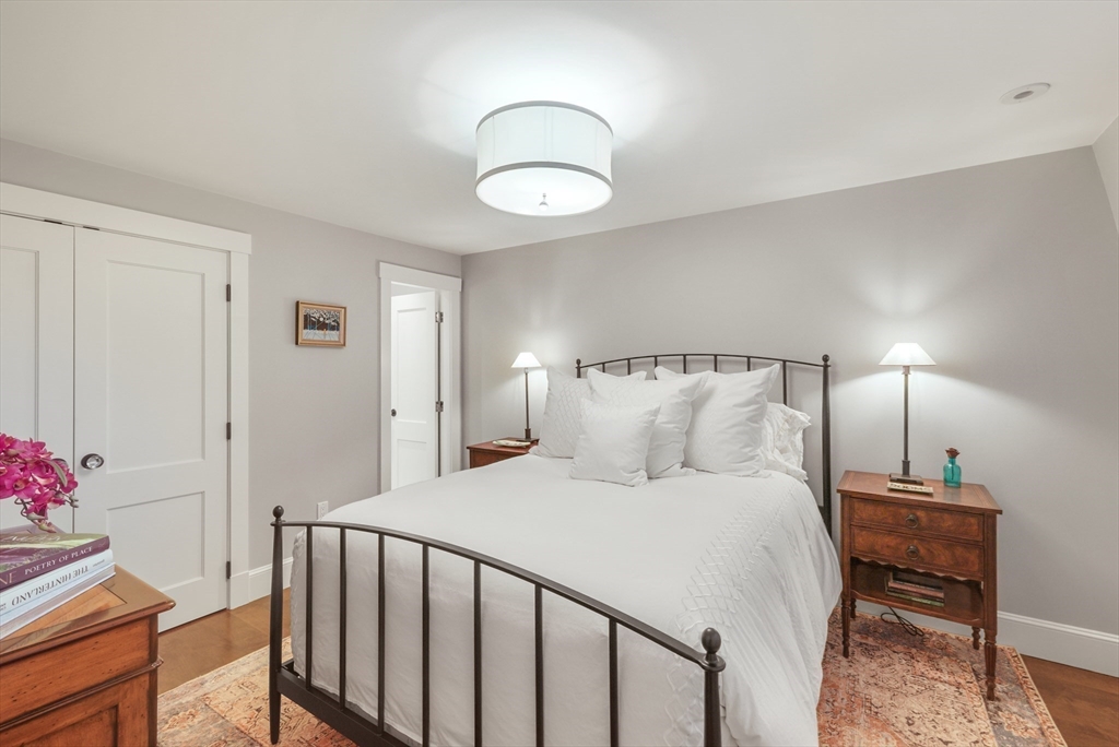 7 Spruce Court Boston, MA 02108 - Photo 16 of 25 a bedroom with a bed and a chandelier