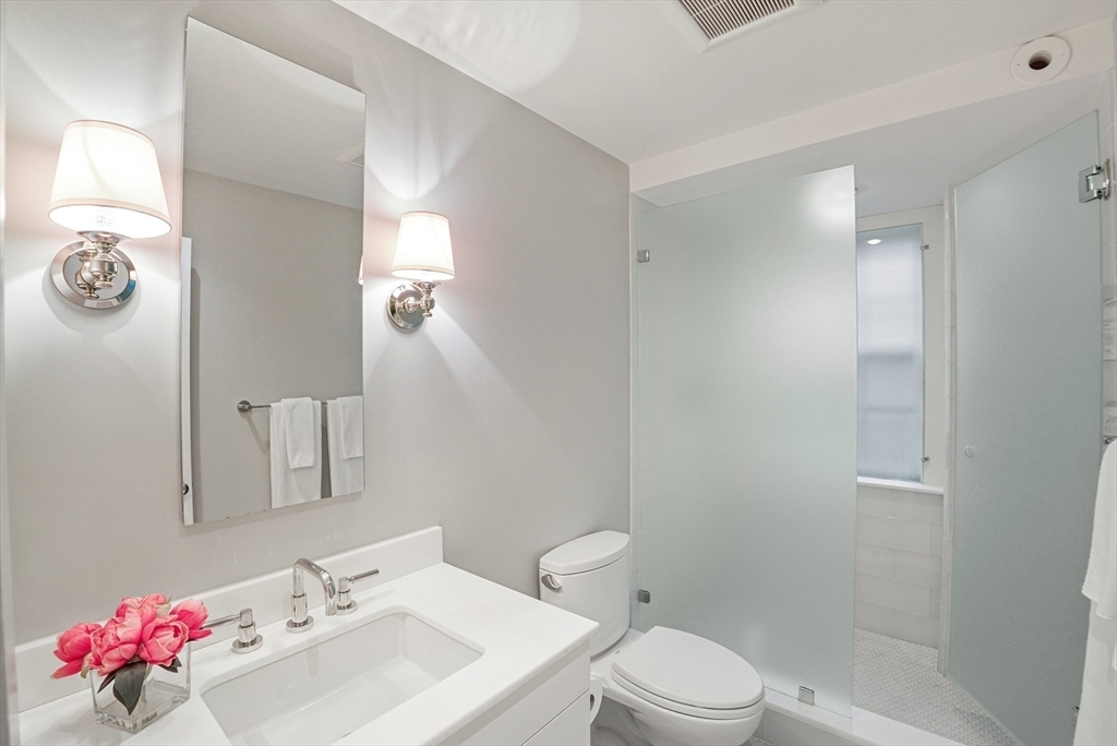 7 Spruce Court Boston, MA 02108 - Photo 18 of 25 a bathroom with a sink mirror and toilet