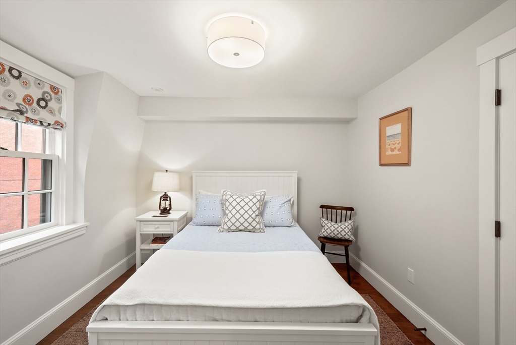 7 Spruce Court Boston, MA 02108 - Photo 19 of 25 a bedroom with a bed and window