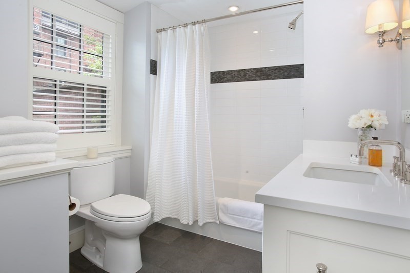 7 Spruce Court Boston, MA 02108 - Photo 20 of 25 a bathroom with a sink a toilet and shower