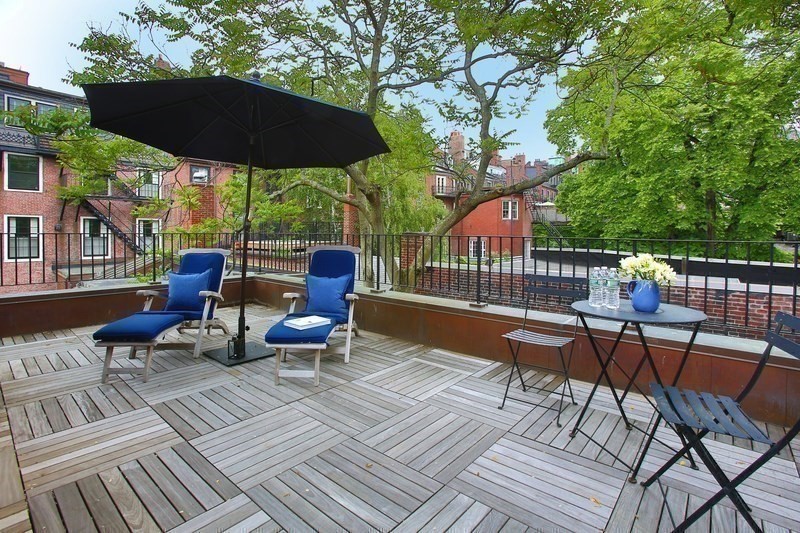 7 Spruce Court Boston, MA 02108 - Photo 22 of 25 a view of a roof deck with furniture