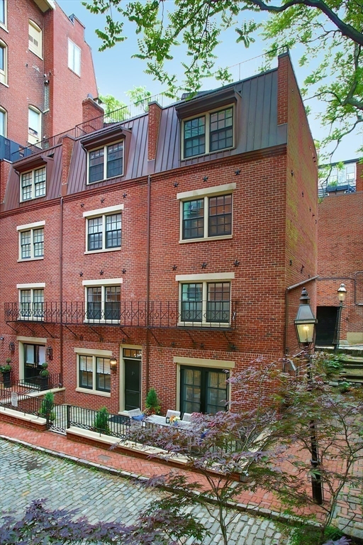 7 Spruce Court Boston, MA 02108 - Photo 23 of 25 a front view of a house with garden
