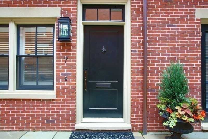 7 Spruce Court Boston, MA 02108 - Photo 24 of 25 a front view of a house with a garden