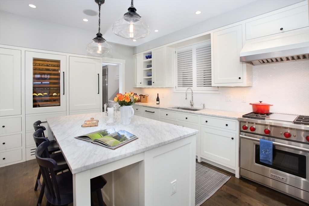 7 Spruce Court Boston, MA 02108 - Photo 4 of 25 a kitchen that has a sink a stove and a table