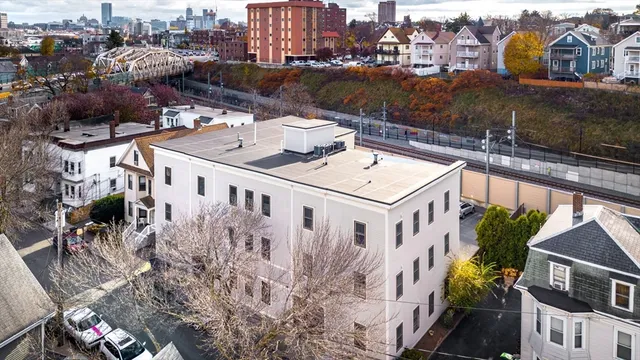 a view of a house with a chairs in patio