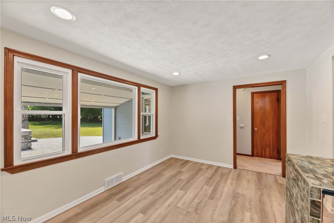 29514 Ridge Road Wickliffe, OH 44092 - Photo 18 of 49 Dining room featuring a textured ceiling and light wood-type flooring