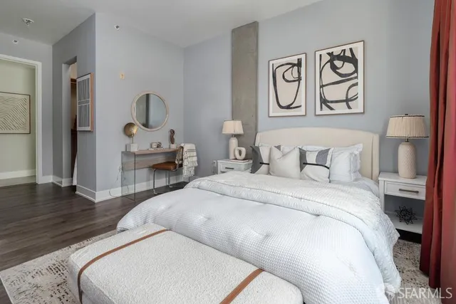 a bedroom with a bed and a book shelf