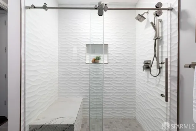 a bedroom with bed and a window