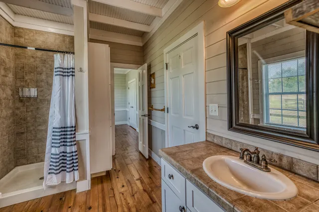 a bathroom with a sink and a mirror