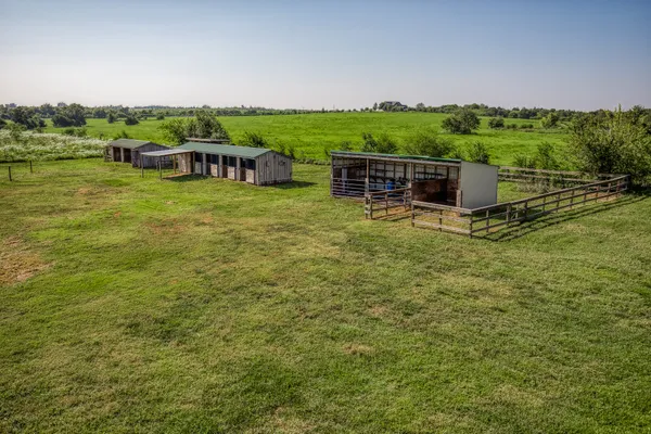 a view of a garden with lawn chairs