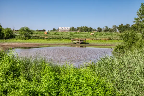 a view of a golf course with a lake