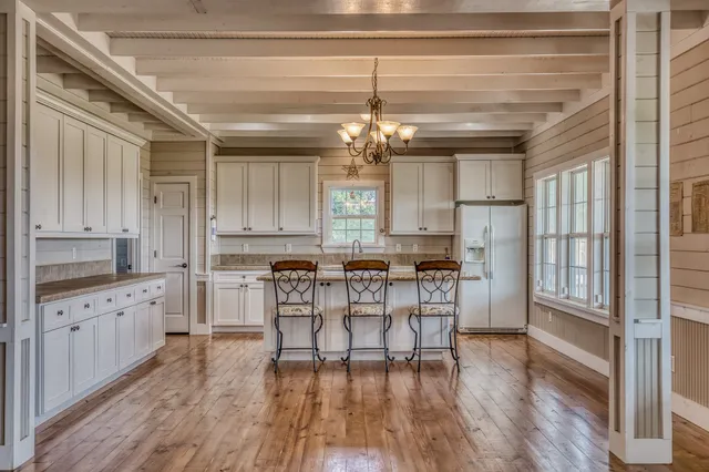 a view of a kitchen and dining room