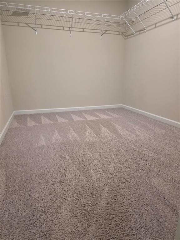 7055 Mimosa Bluff Lithonia, GA 30038 - Photo 12 of 17 a view of a room with racks on the wall