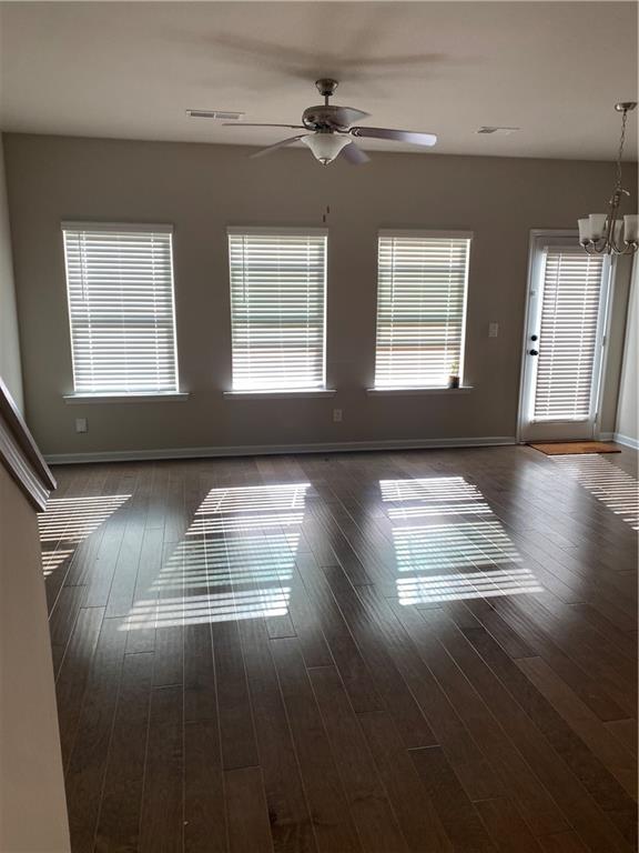 7055 Mimosa Bluff Lithonia, GA 30038 - Photo 6 of 17 a view of empty room with wooden floor and fan