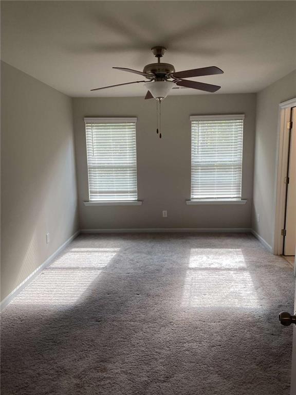 7055 Mimosa Bluff Lithonia, GA 30038 - Photo 9 of 17 a view of an empty room with windows