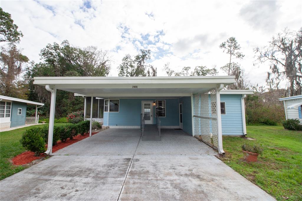 Front View - Double Driveway w/ 2 Car Carport