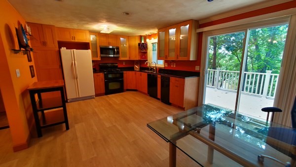 8 Apple Ridge Road, Unit 3 Maynard, MA 01754 - Photo 6 of 39 a kitchen with sink refrigerator and large window