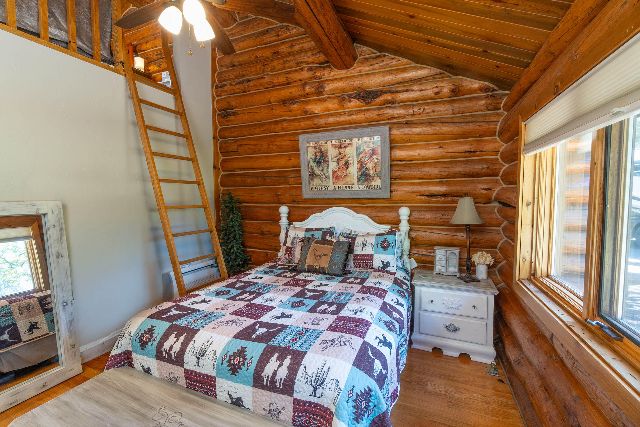 32907 River Bend Road Chiloquin, OR 97624 - Photo 15 of 83 a bedroom with a bed and wooden floor