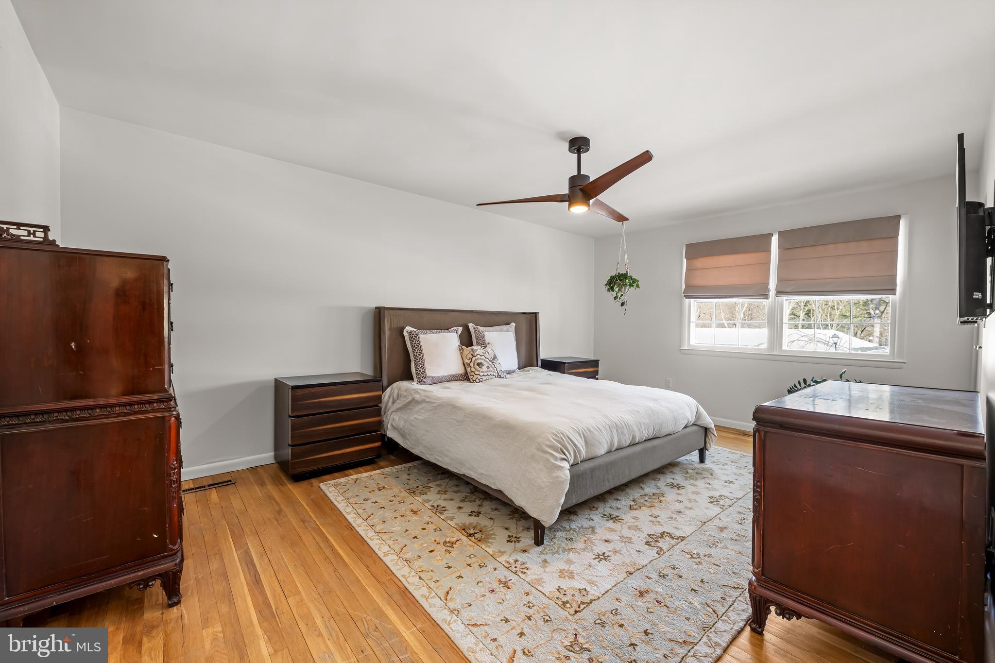 3407 Birch Hollow Road Baltimore, MD 21208 - Photo 29 of 47 a bedroom with a bed and a refrigerator