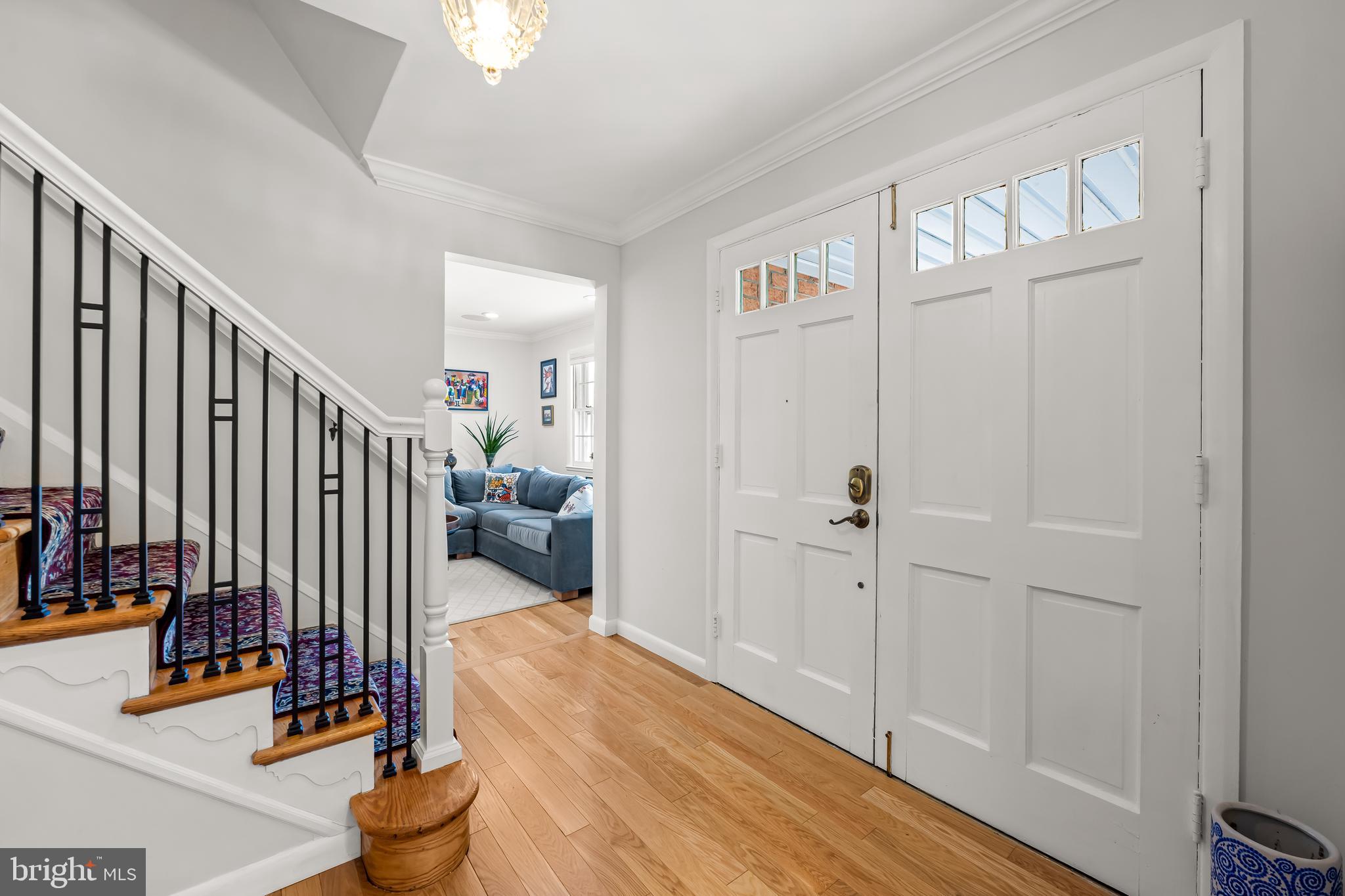3407 Birch Hollow Road Baltimore, MD 21208 - Photo 3 of 47 a view of a hallway with wooden floor and stairs