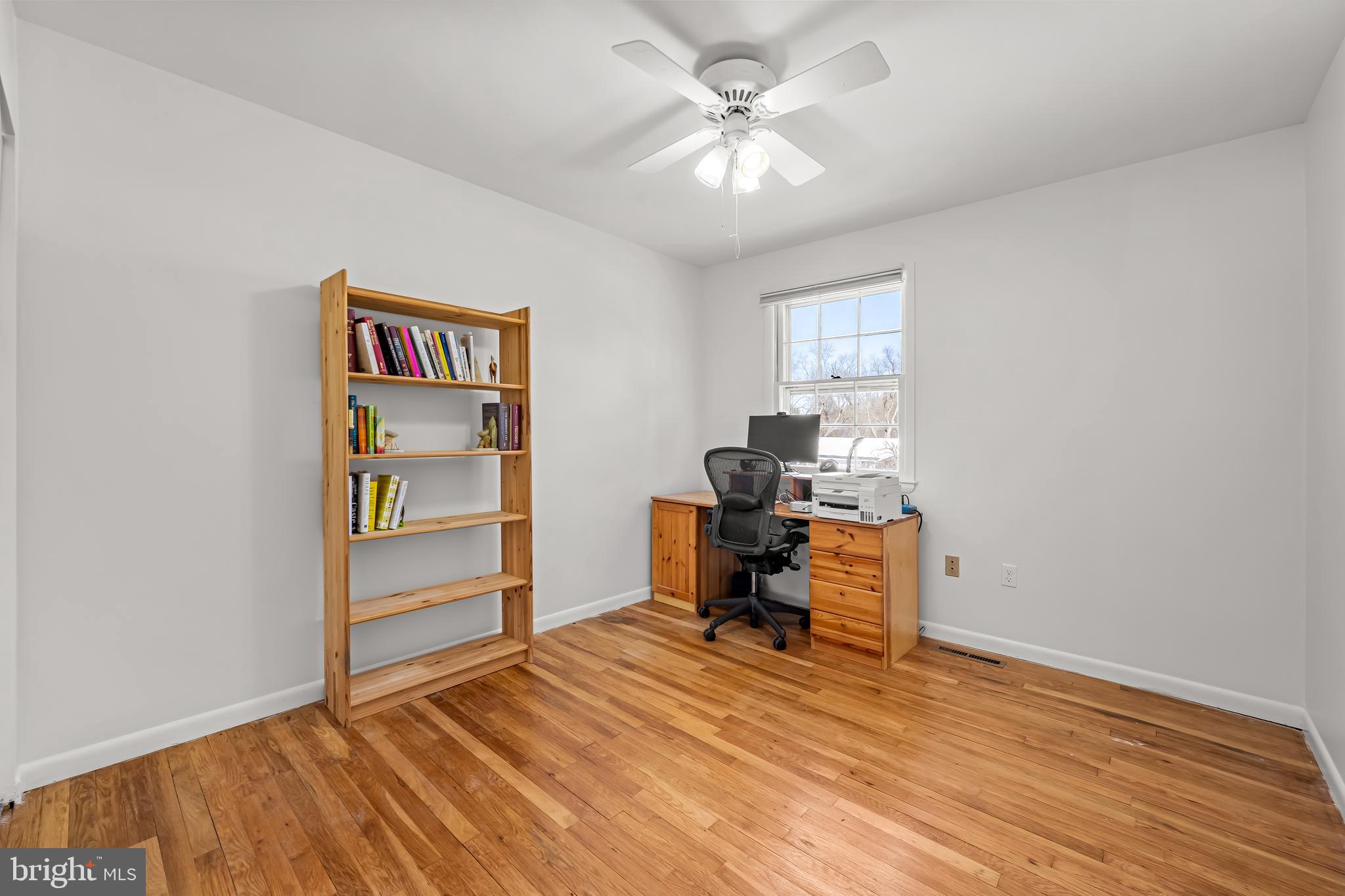 3407 Birch Hollow Road Baltimore, MD 21208 - Photo 37 of 47 a view of a workspace with furniture and a window