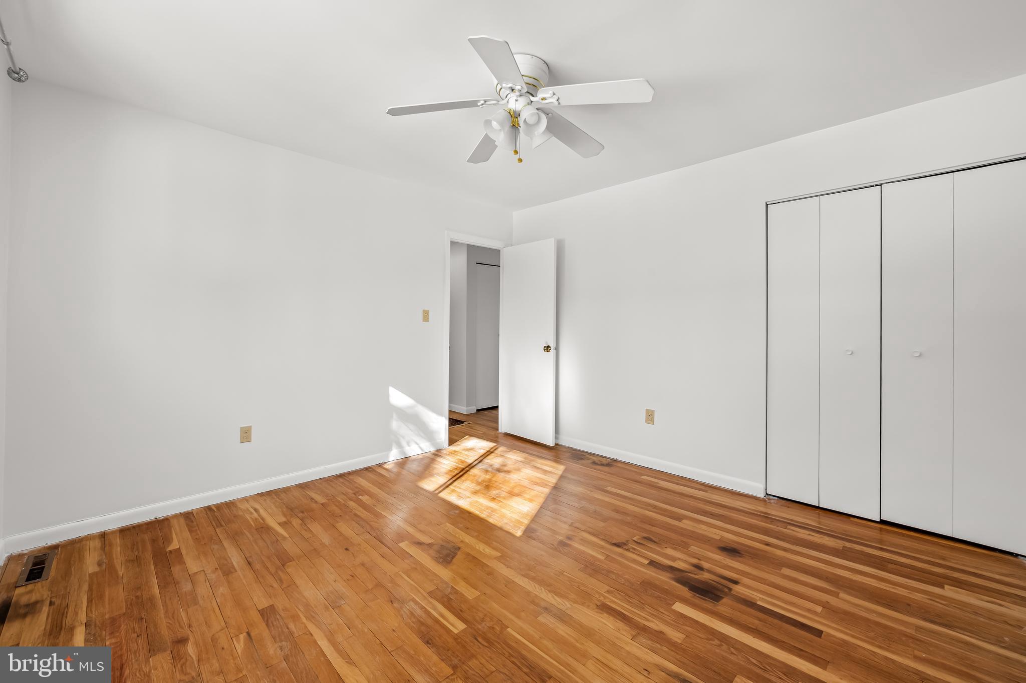 3407 Birch Hollow Road Baltimore, MD 21208 - Photo 39 of 47 a view of a room with a ceiling fan