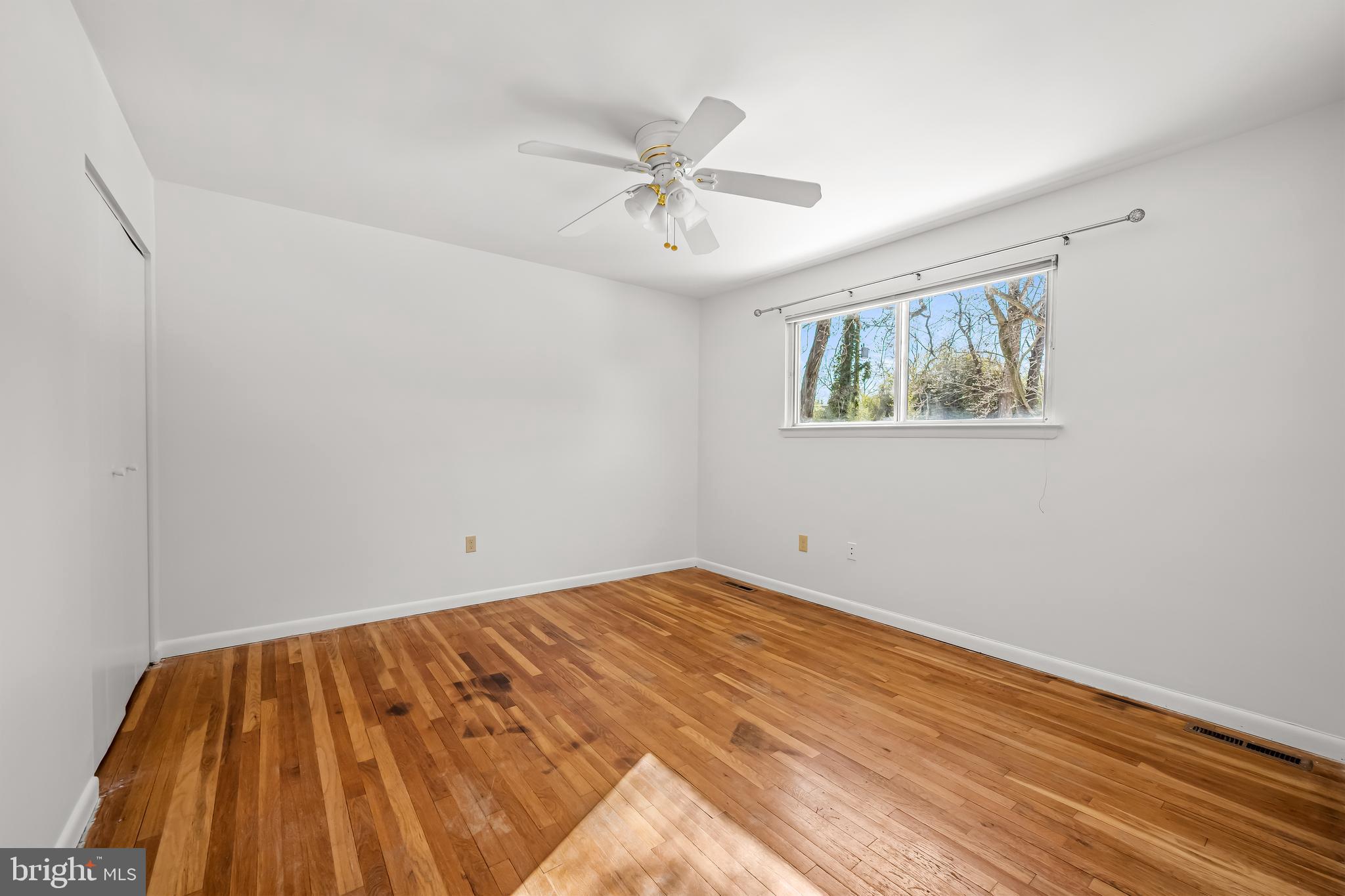 3407 Birch Hollow Road Baltimore, MD 21208 - Photo 40 of 47 a view of an empty room with wooden floor