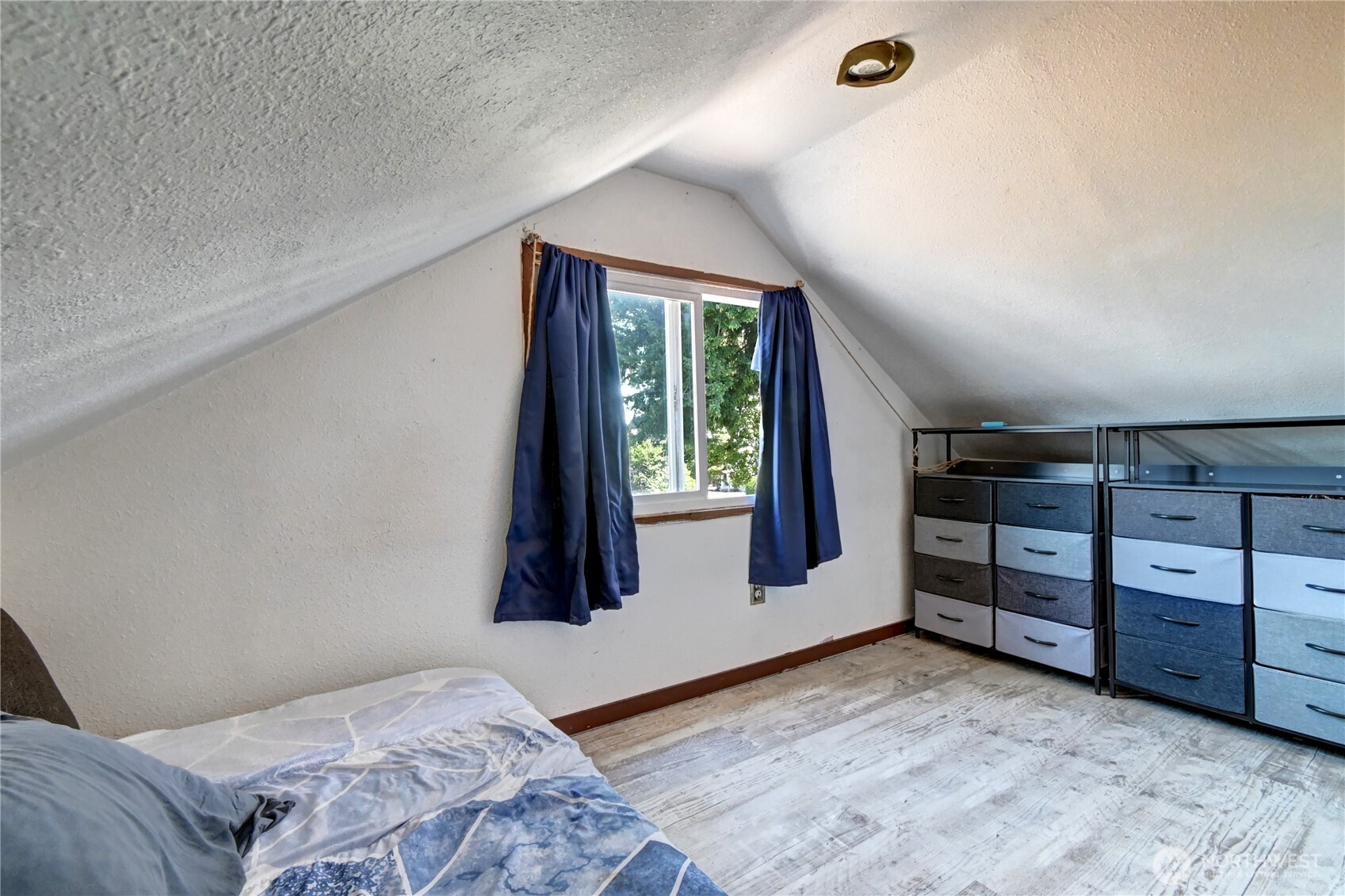 2327 Harrison Avenue Everett, WA 98201 - Photo 12 of 21 a bedroom with a bed and a window