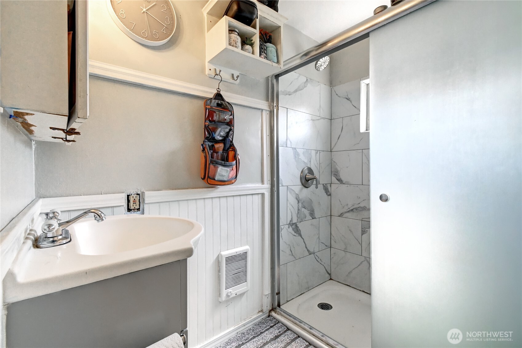 2327 Harrison Avenue Everett, WA 98201 - Photo 6 of 21 a bathroom with a sink a mirror and shower