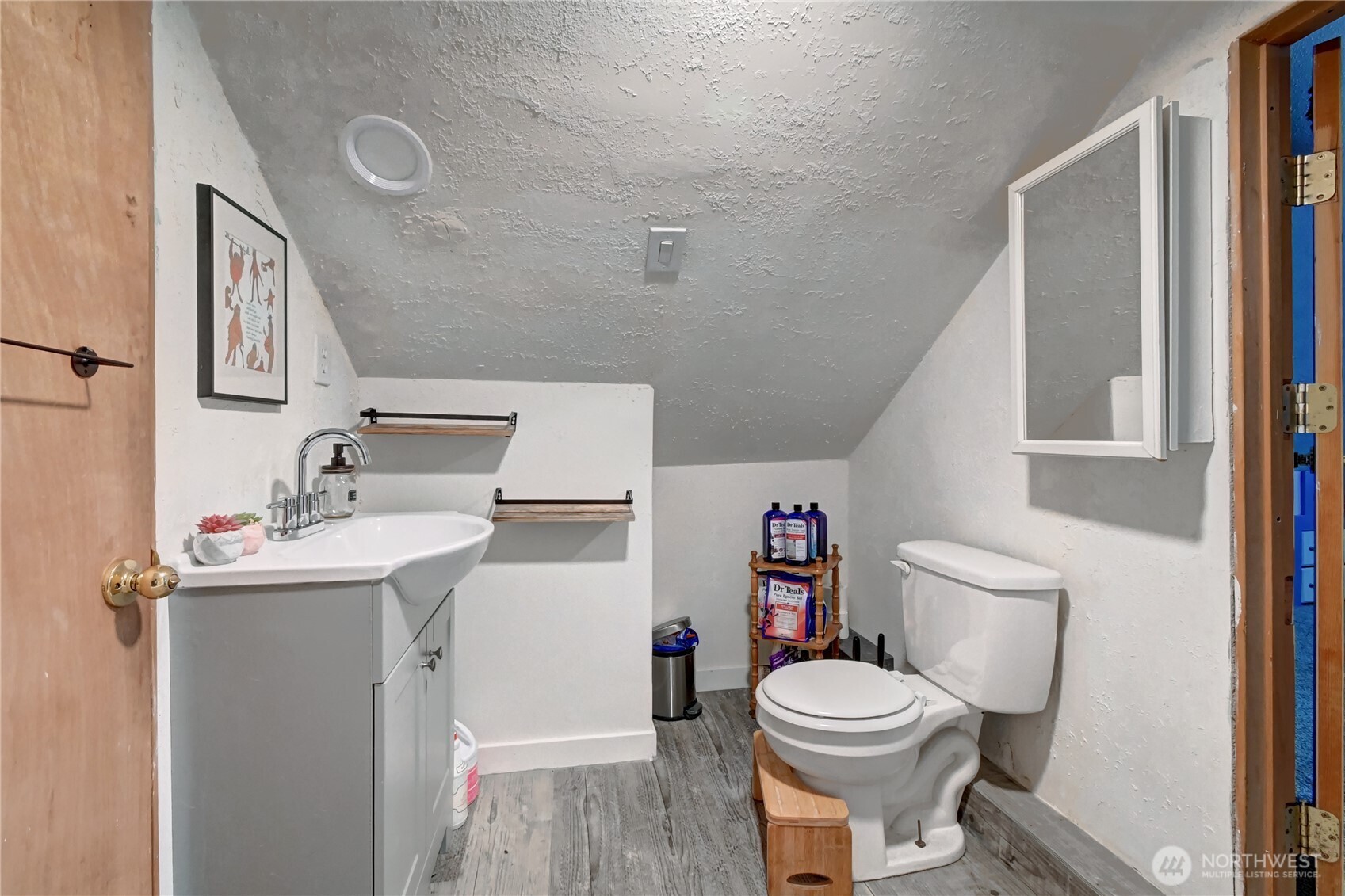 2327 Harrison Avenue Everett, WA 98201 - Photo 9 of 21 a bathroom with a sink a toilet and a mirror