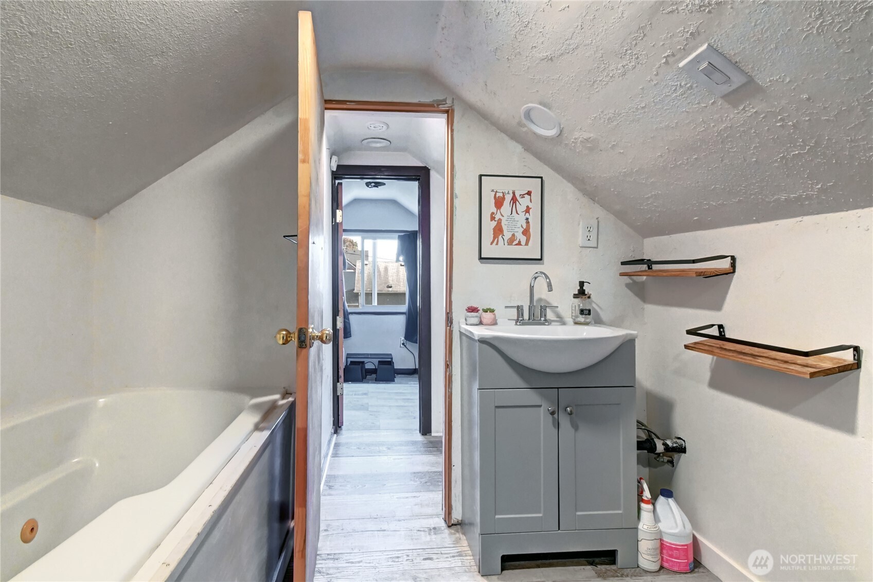 2327 Harrison Avenue Everett, WA 98201 - Photo 10 of 21 a bathroom with a sink and a bathtub