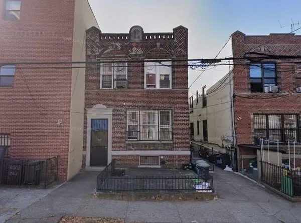 a front view of a house with a garage