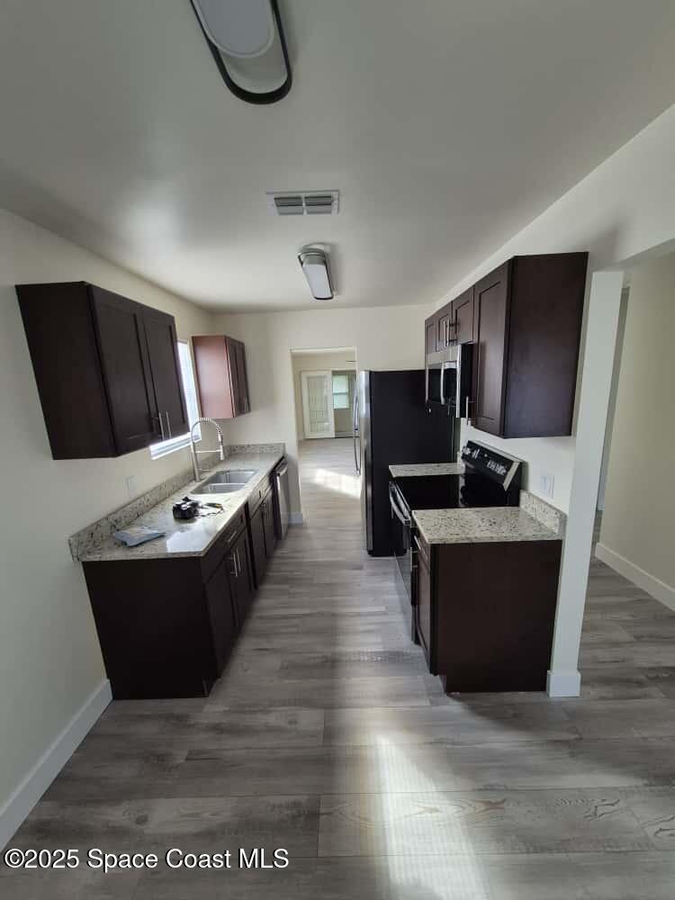 1341 Cheney Highway, Unit H Titusville, FL 32780 - Photo 4 of 16 IMG_4044 cheney