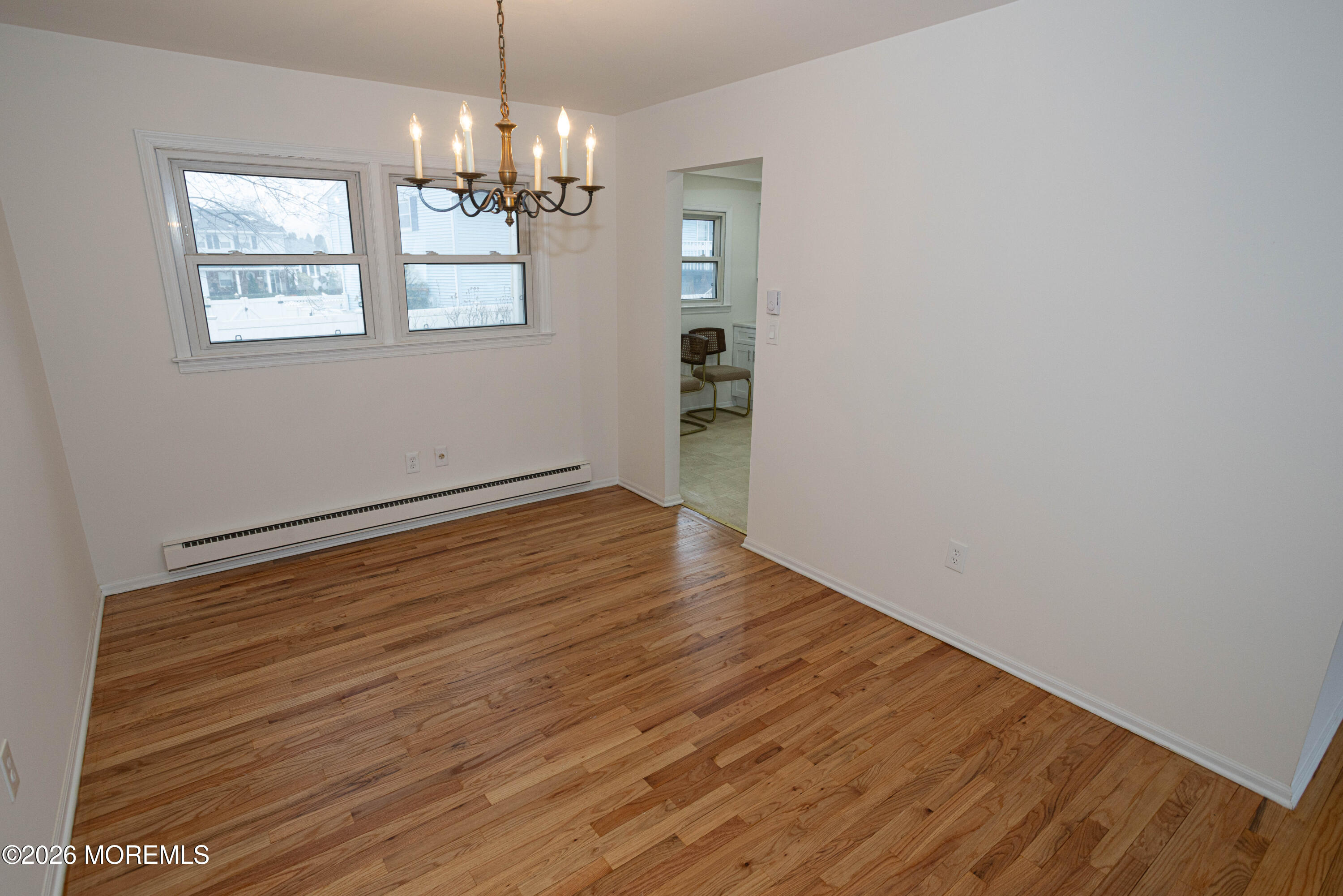 21 Sherwood Road Parlin, NJ 08859 - Photo 12 of 41 a view of a room with wooden floor and chandelier