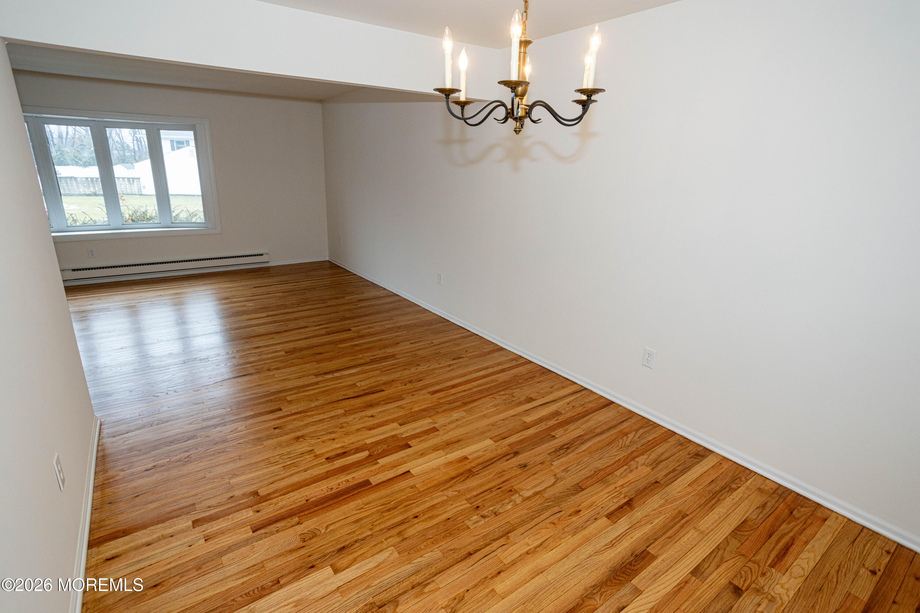 21 Sherwood Road Parlin, NJ 08859 - Photo 14 of 41 an empty room with wooden floor fan and windows