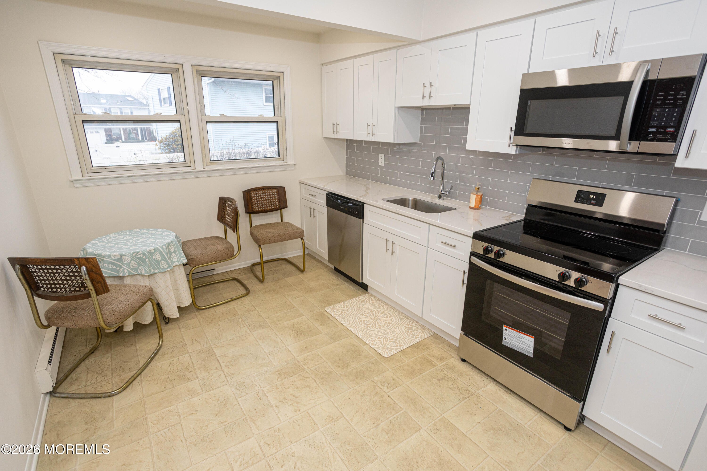 21 Sherwood Road Parlin, NJ 08859 - Photo 15 of 41 a kitchen with stainless steel appliances a stove sink and microwave