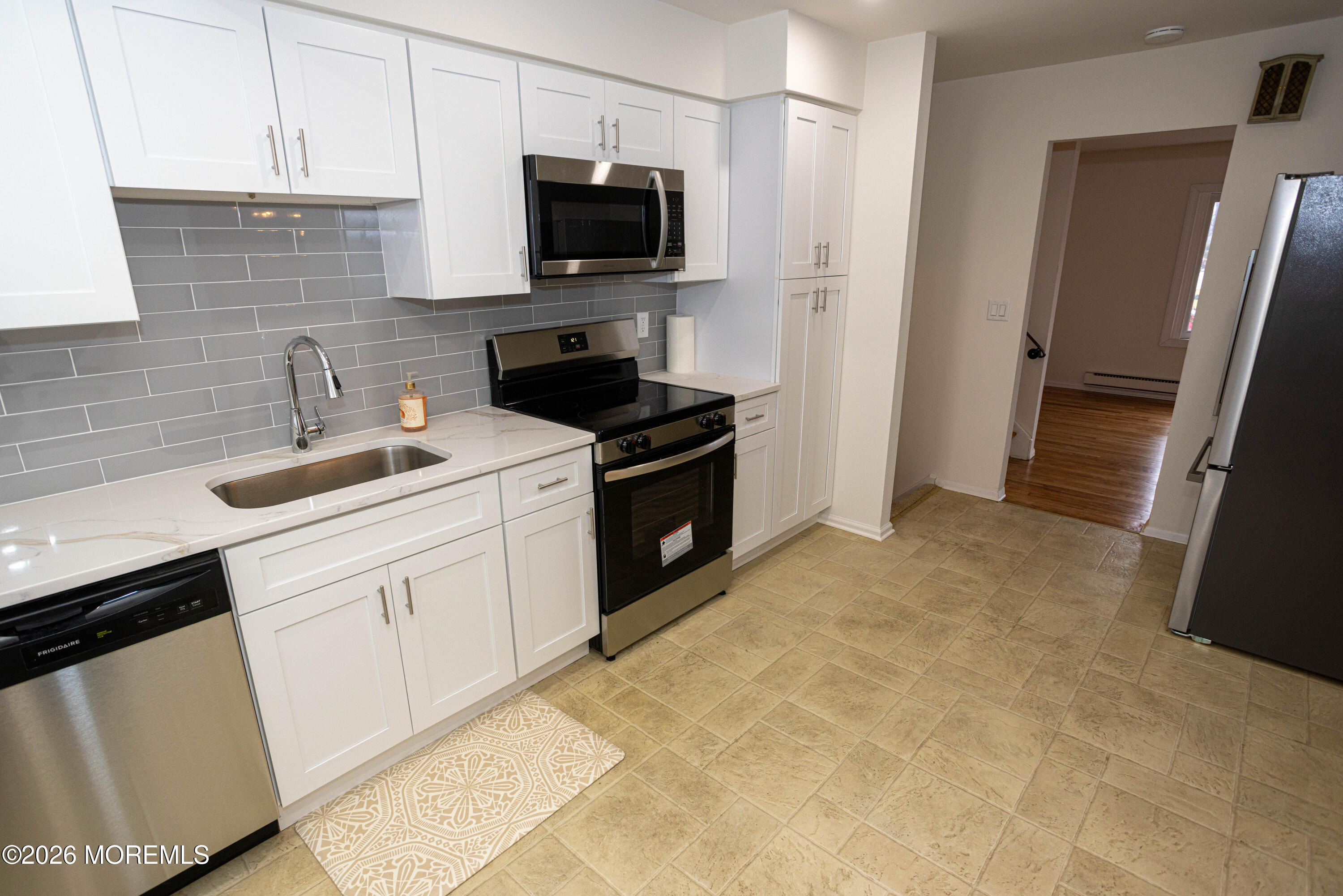 21 Sherwood Road Parlin, NJ 08859 - Photo 18 of 41 a kitchen with a sink stove and refrigerator