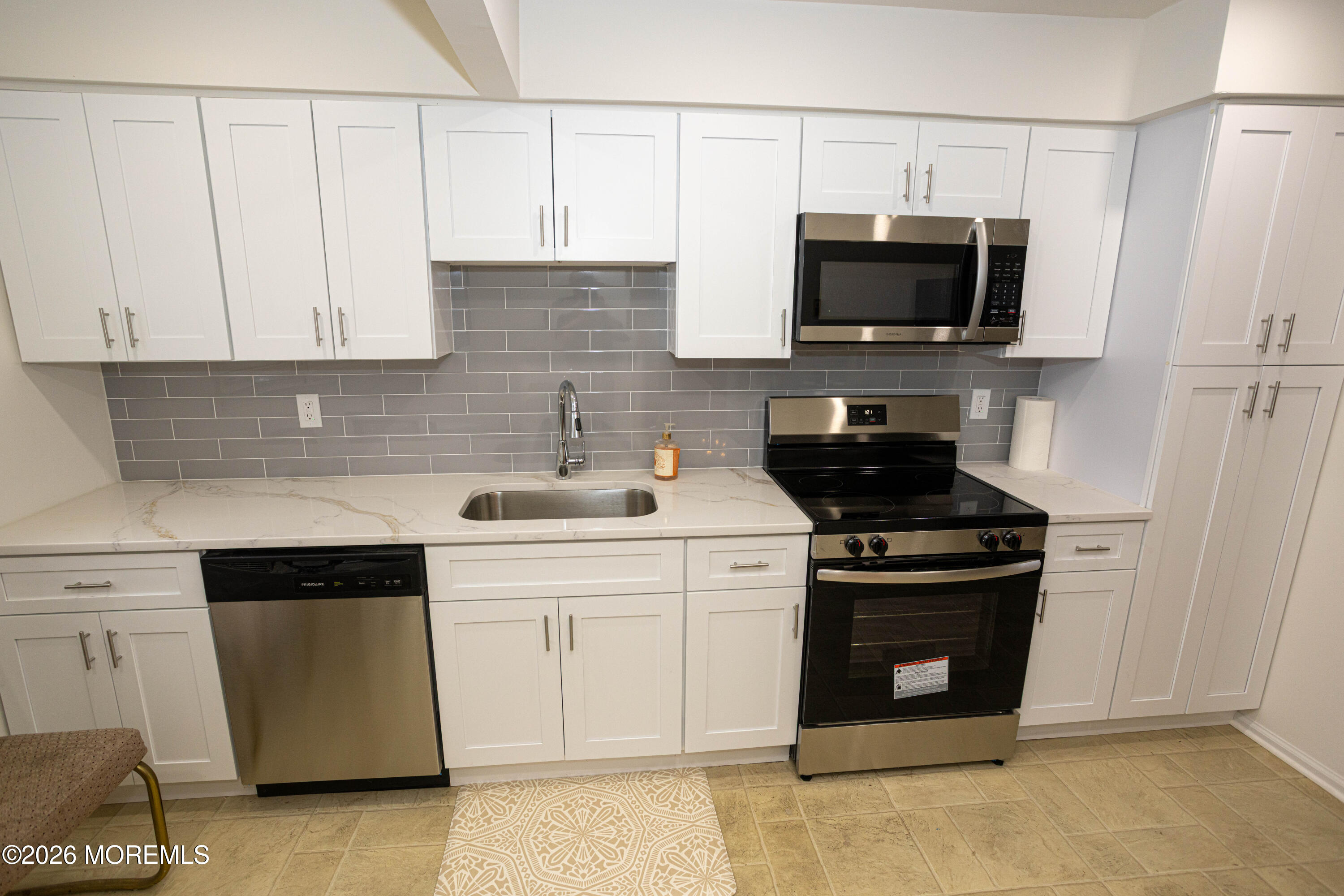 21 Sherwood Road Parlin, NJ 08859 - Photo 19 of 41 a kitchen with stainless steel appliances granite countertop white cabinets a stove top oven a sink and dishwasher